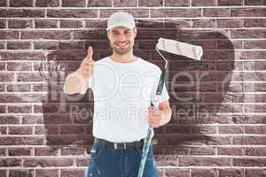 Composite image of happy man with paint roller gesturing thumbs up