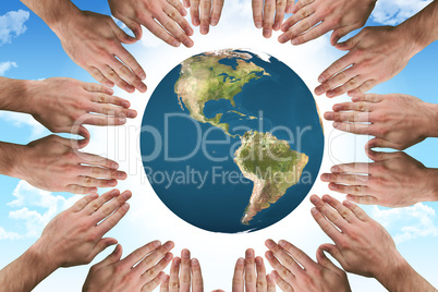 Composite image of circle of hands