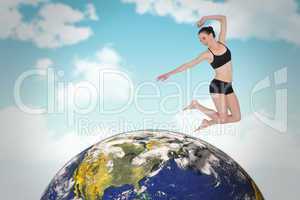 Composite image of full length of a sporty young woman jumping