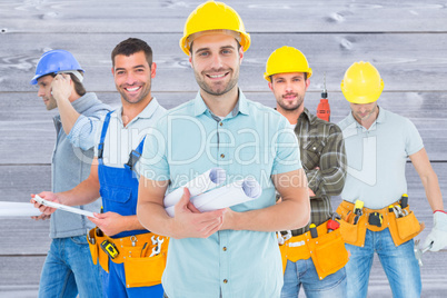 Composite image of happy male architect holding blueprints