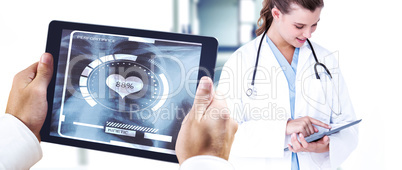 Composite image of man using tablet pc