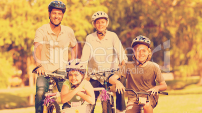 Family with their bikes in a park