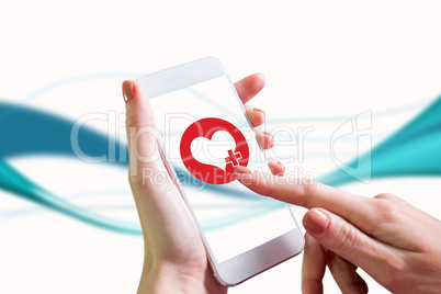 Composite image of hand holding smartphone