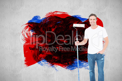 Composite image of confident man holding paint roller on white background