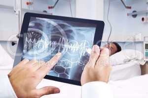 Composite image of man using tablet pc