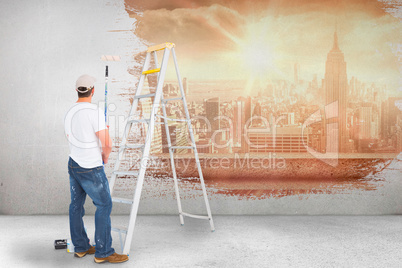 Composite image of handyman with paint roller and ladder