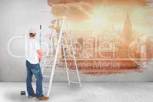 Composite image of handyman with paint roller and ladder