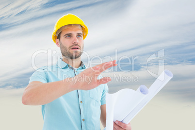 Composite image of architect with blueprint gesturing on white b