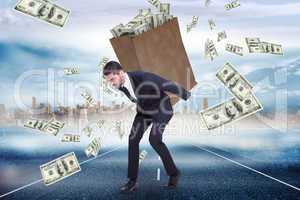 Composite image of businessman carrying bag of dollars