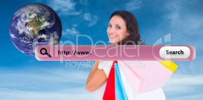 Composite image of pretty brunette with shopping bags