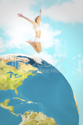 Composite image of gorgeous fit blonde jumping with arms out