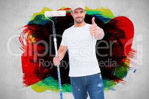 Composite image of handyman holding paint roller