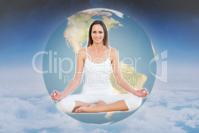 Composite image of toned woman in lotus pose at fitness studio