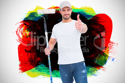 Composite image of handyman holding paint roller