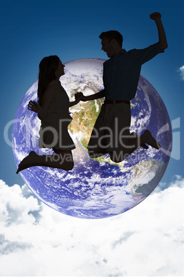 Composite image of cheerful young couple jumping