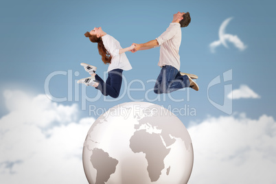 Composite image of couple jumping and holding hands