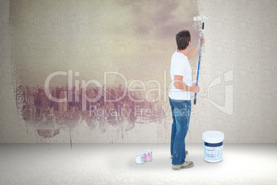 Composite image of man painting on white background