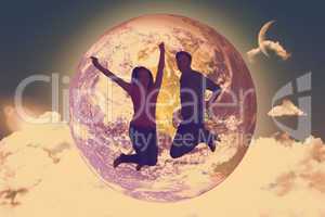 Composite image of cheerful young couple jumping