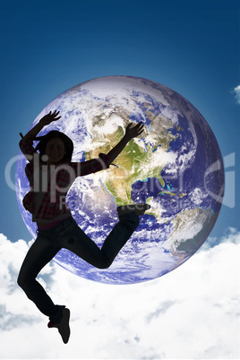 Composite image of casual brunette jumping and smiling