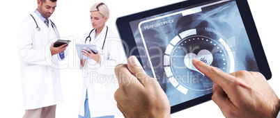Composite image of man using tablet pc Composite image of man using tablet pc
