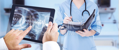 Composite image of man using tablet pc