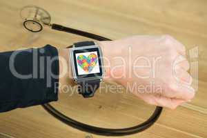 Composite image of businesswoman with smart watch on wrist