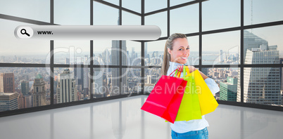 Composite image of smiling blonde holding shopping bags