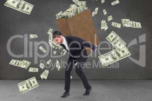 Composite image of businessman carrying bag of dollars