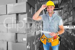 Composite image of portrait of smiling manual worker holding cli
