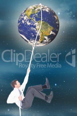 Composite image of businessman pulling a rope