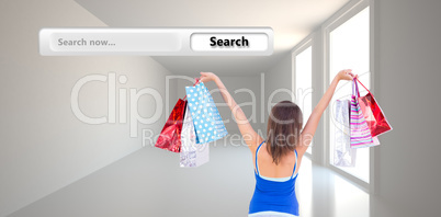 Composite image of rear view of a brunette woman raising shoppin