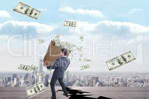 Composite image of businessman carrying bag of dollars