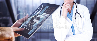 Composite image of man using tablet pc