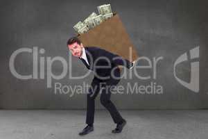 Composite image of businessman carrying something with his back