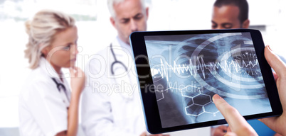 Composite image of man using tablet pc