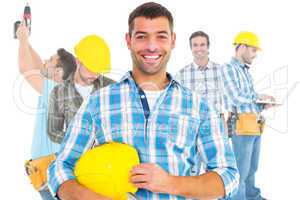 Composite image of smiling handyman holding hardhat and hammer