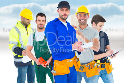 Composite image of handyman in blue overall writing on clipboard