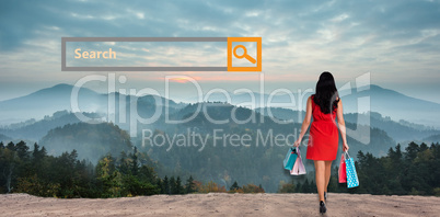 Composite image of woman standing with shopping bags