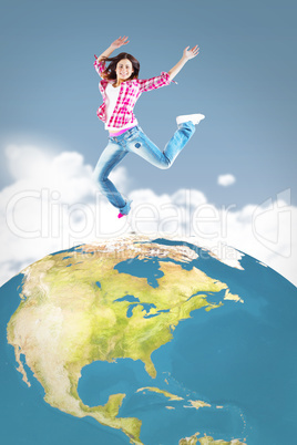 Composite image of casual brunette jumping and smiling