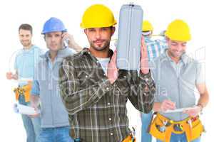 Composite image of repairman holding toolbox