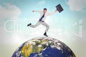 Composite image of cheerful jumping businessman with his suitcas