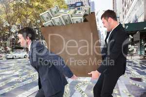 Composite image of businessmen carrying bag of dollars