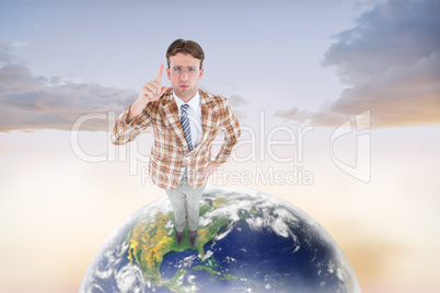 Composite image of upset geeky hipster pointing at camera