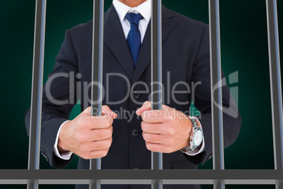 Composite image of portrait of a businessman clenching fists