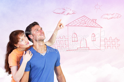 Composite image of happy couple looking upwards