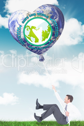 Composite image of businessman pulling a rope