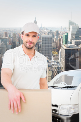 Composite image of delivery man carrying package