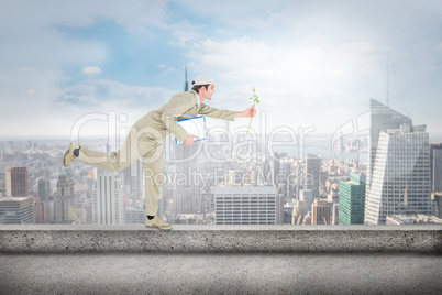 Composite image of delivery man with clipboard offering flower