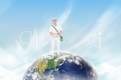 Composite image of happy delivery man using digital tablet