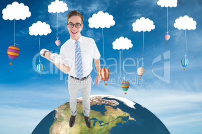 Composite image of geeky happy businessman lifting dumbbell